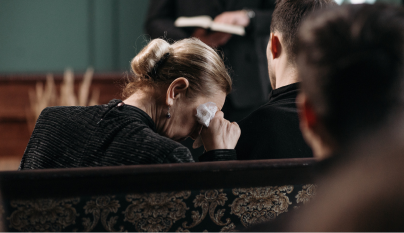Woman crying at a funeral