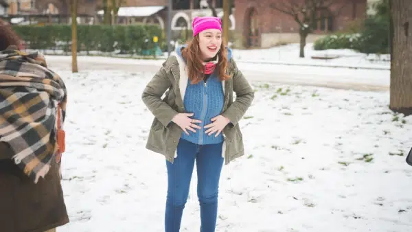 a girl playing in the snow